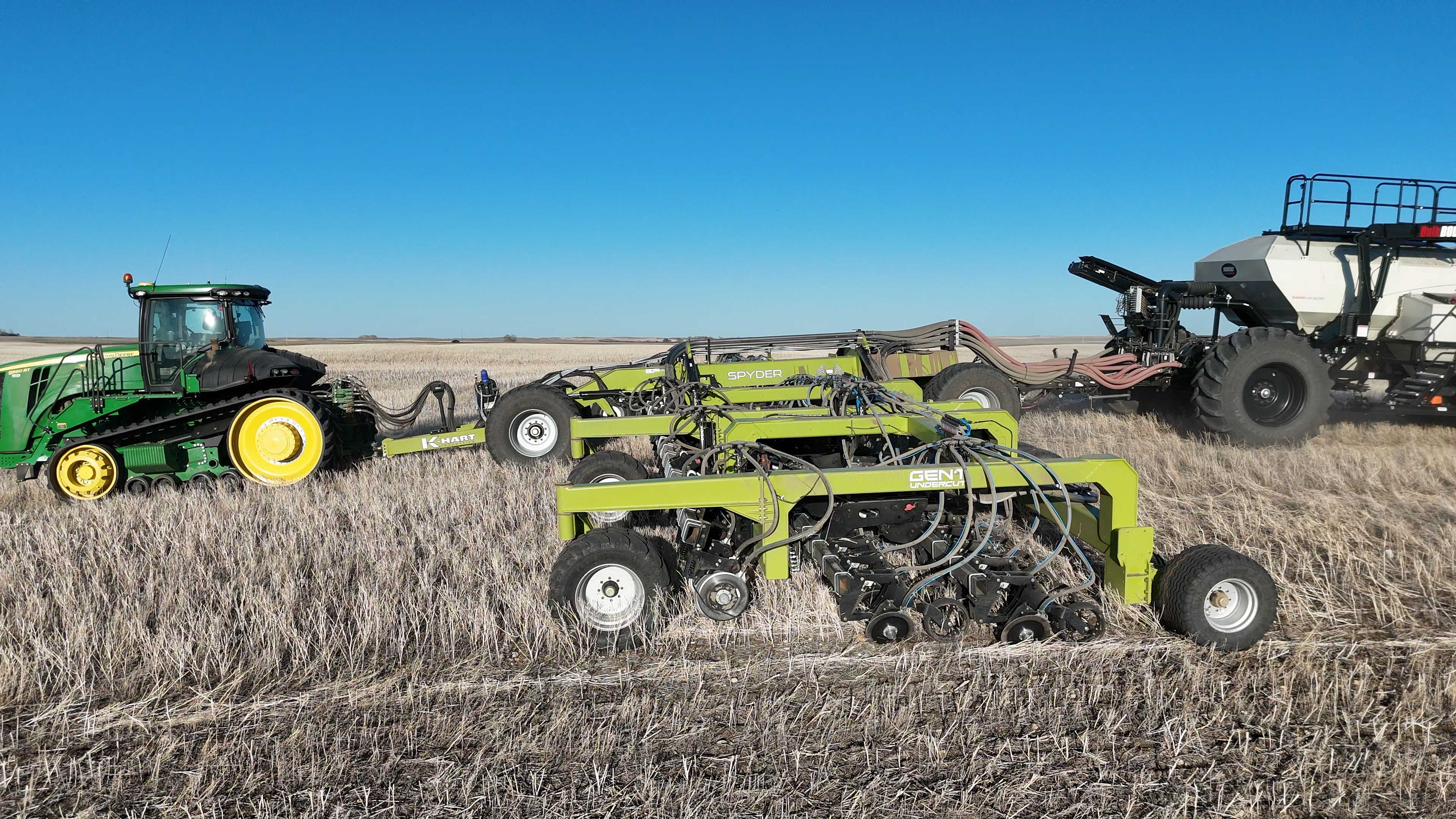 Spyder disc drill moving through heavy residue in field