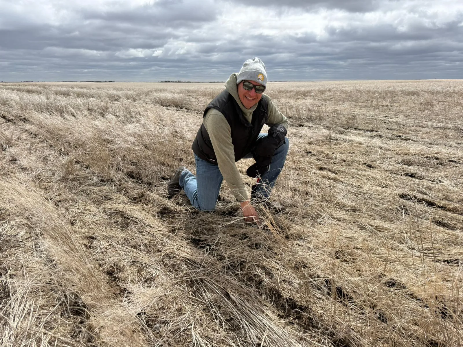 Jason checking seed placement in the field