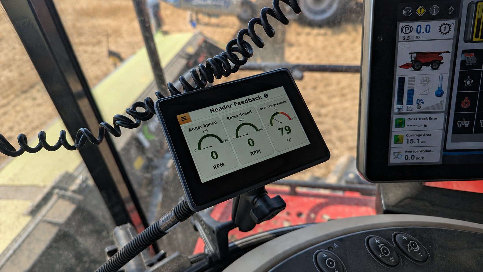 Header Feedback monitor showing auger speed, rotor speed, and belt temperature